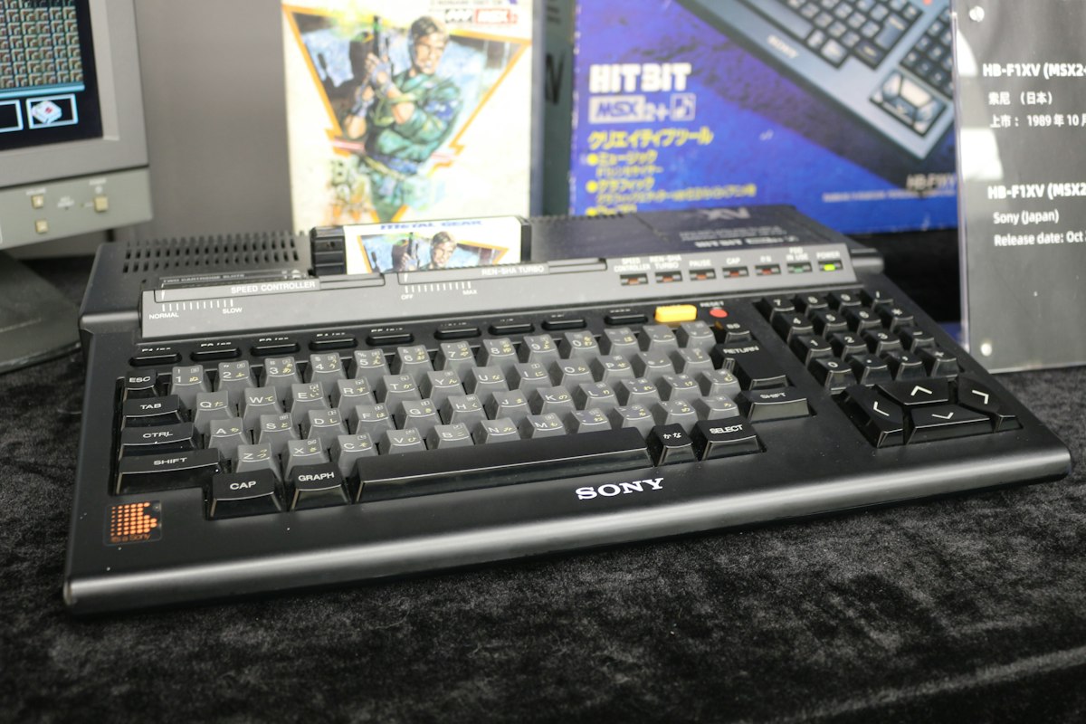 A computer keyboard sitting on top of a desk