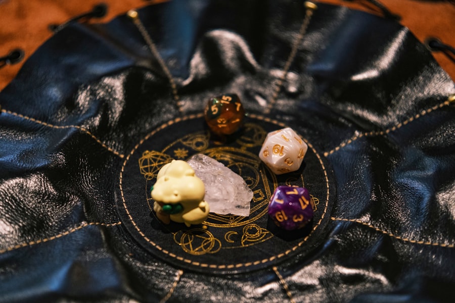 Dice and crystals rest on a black, leather pouch.