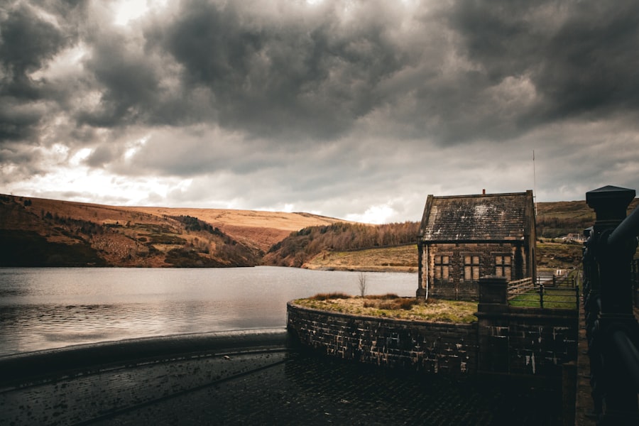 A moody landscape with an old stone house.