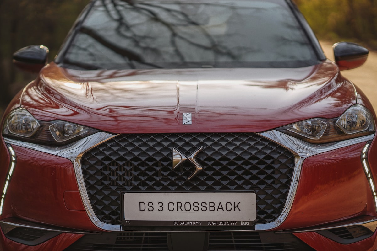 a close up of the front of a red car