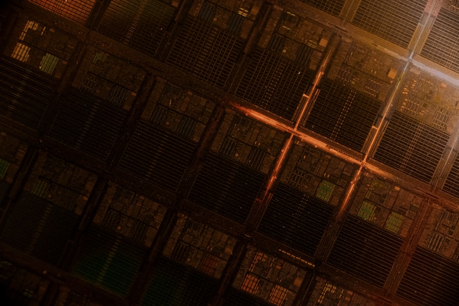 A man standing in front of a large stack of servers