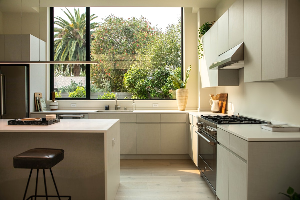 modern kitchen with island and large window