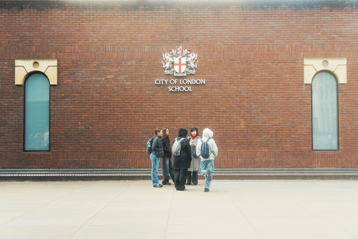 Students gather in front of city of london school entrance
