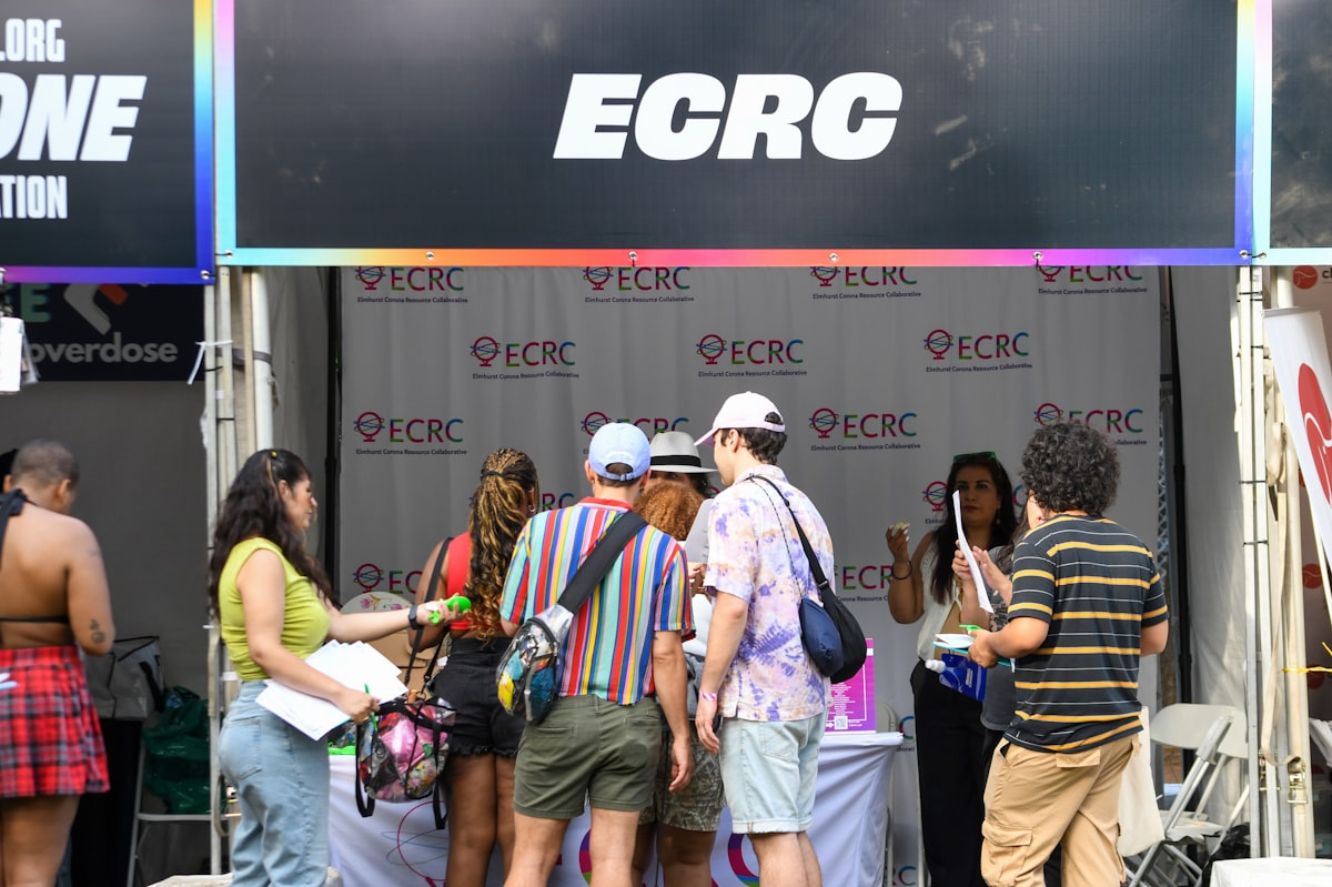 People gather at the ecrc booth.