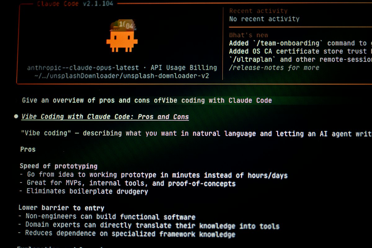 A pixelated orange character with a hat