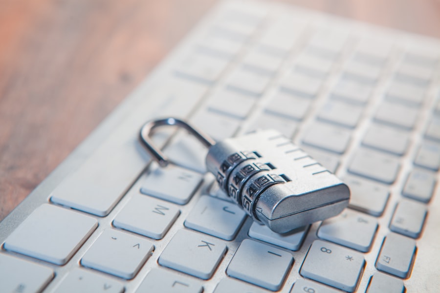 A combination lock rests on a computer keyboard.