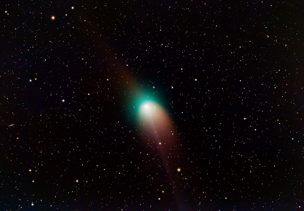A very bright green object in the middle of the night sky