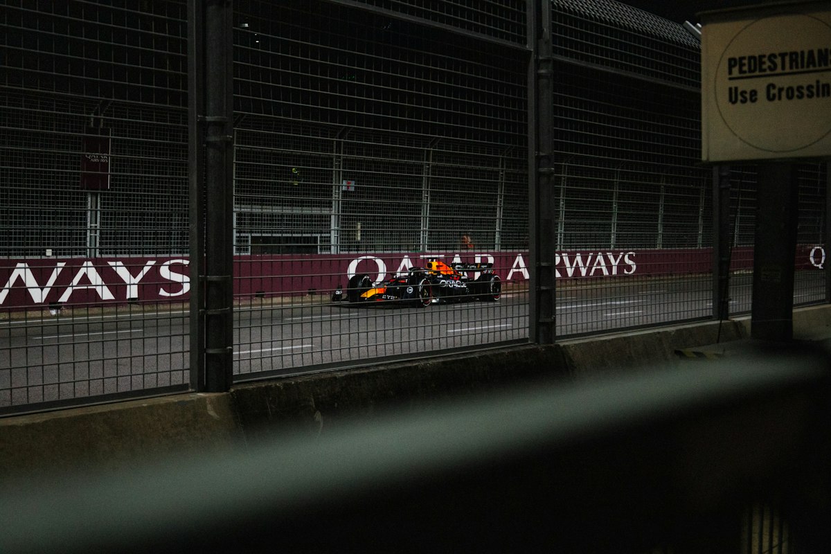 A race car is driving on the track