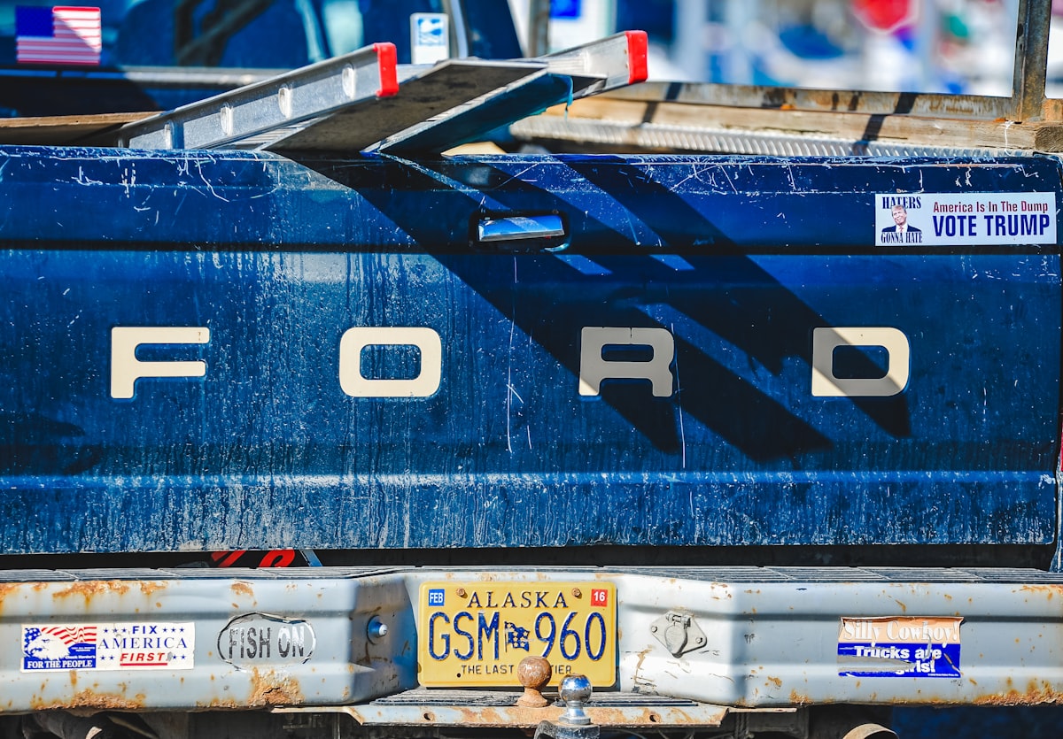 Blue ford truck tailgate with alaska license plate