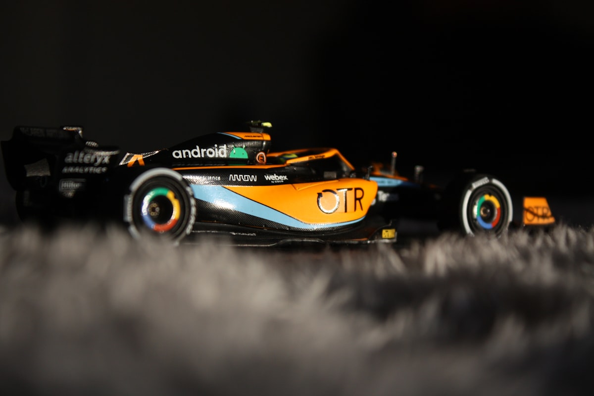 A mclaren formula 1 car speeds on a track.