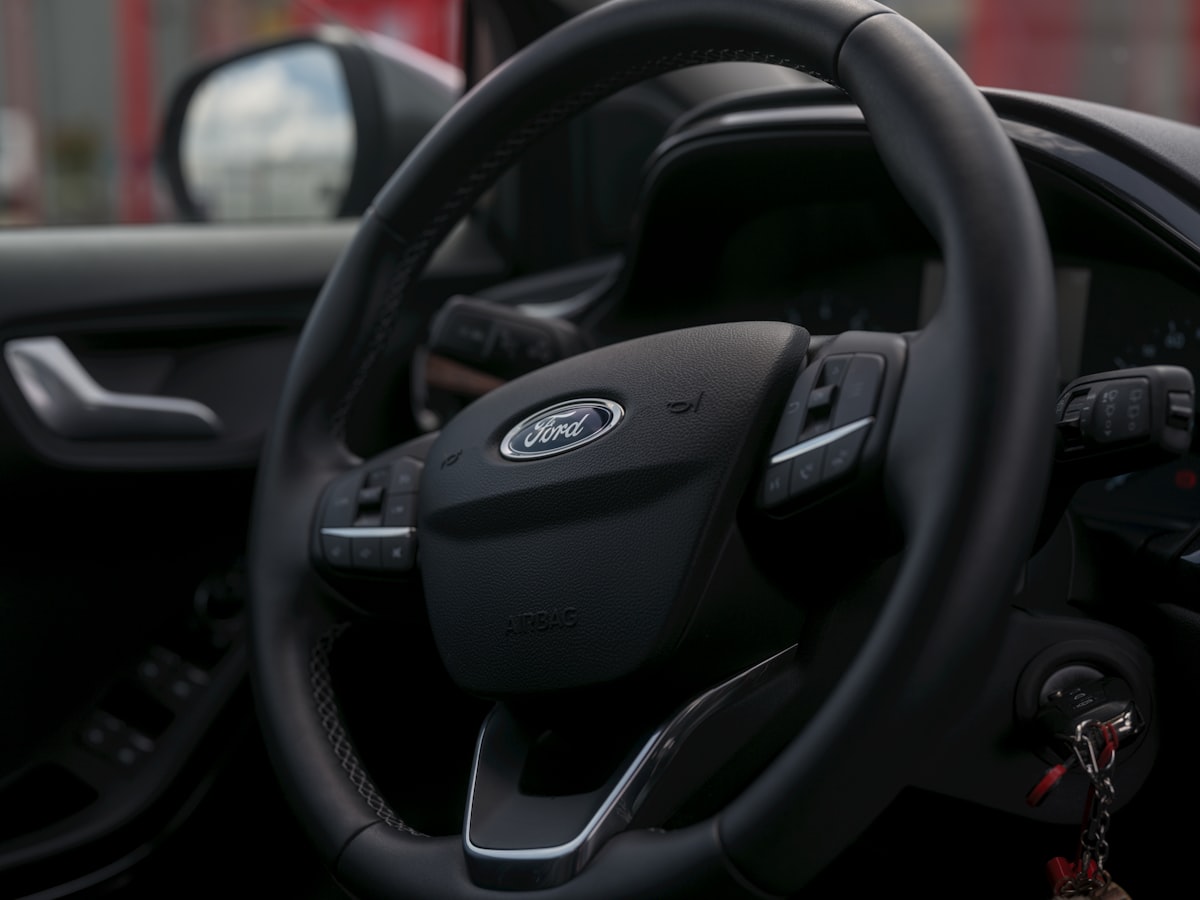 A ford car's steering wheel is visible