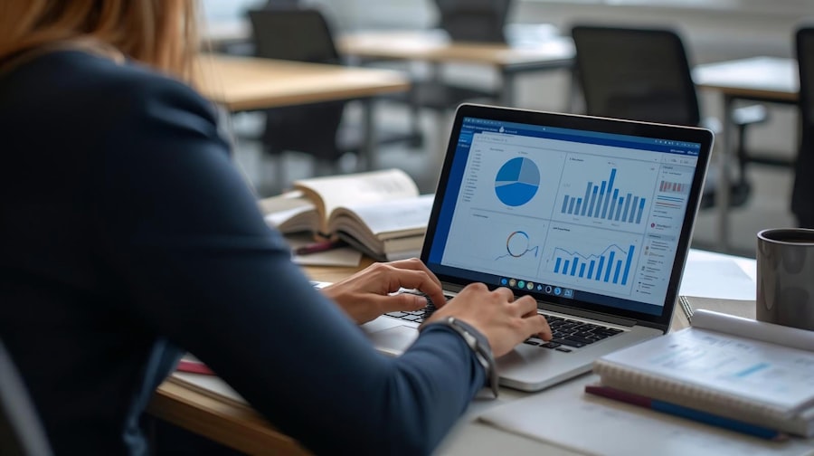 Woman working on laptop with charts and graphs.