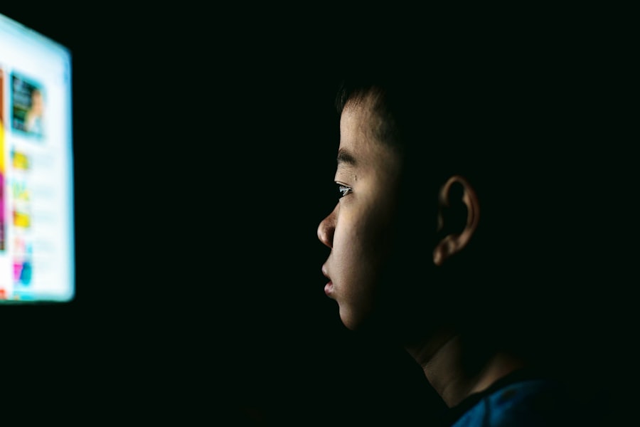 boy watching in front of a monitor