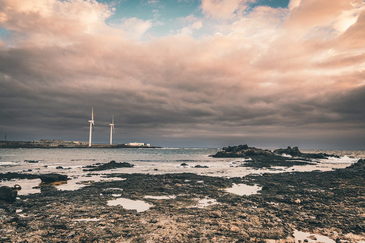 A large body of water under a cloudy sky