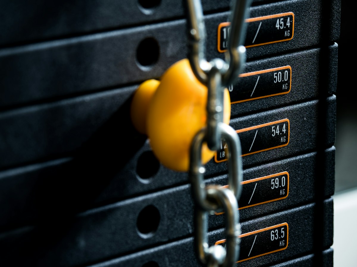 black and yellow metal padlock