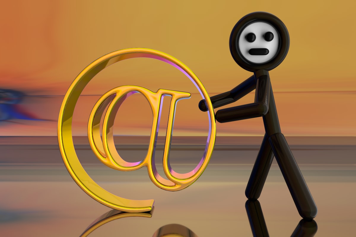 Stick figure holding a golden email symbol