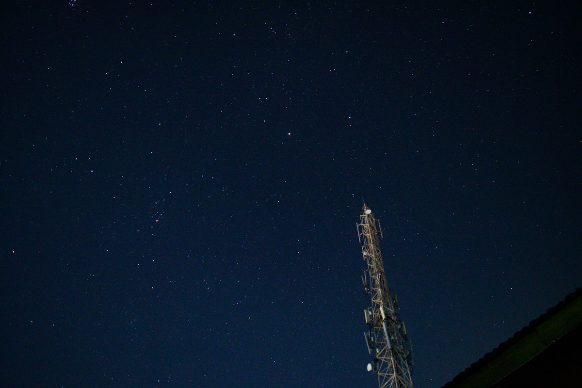 brown and white tower under blue sky during night time