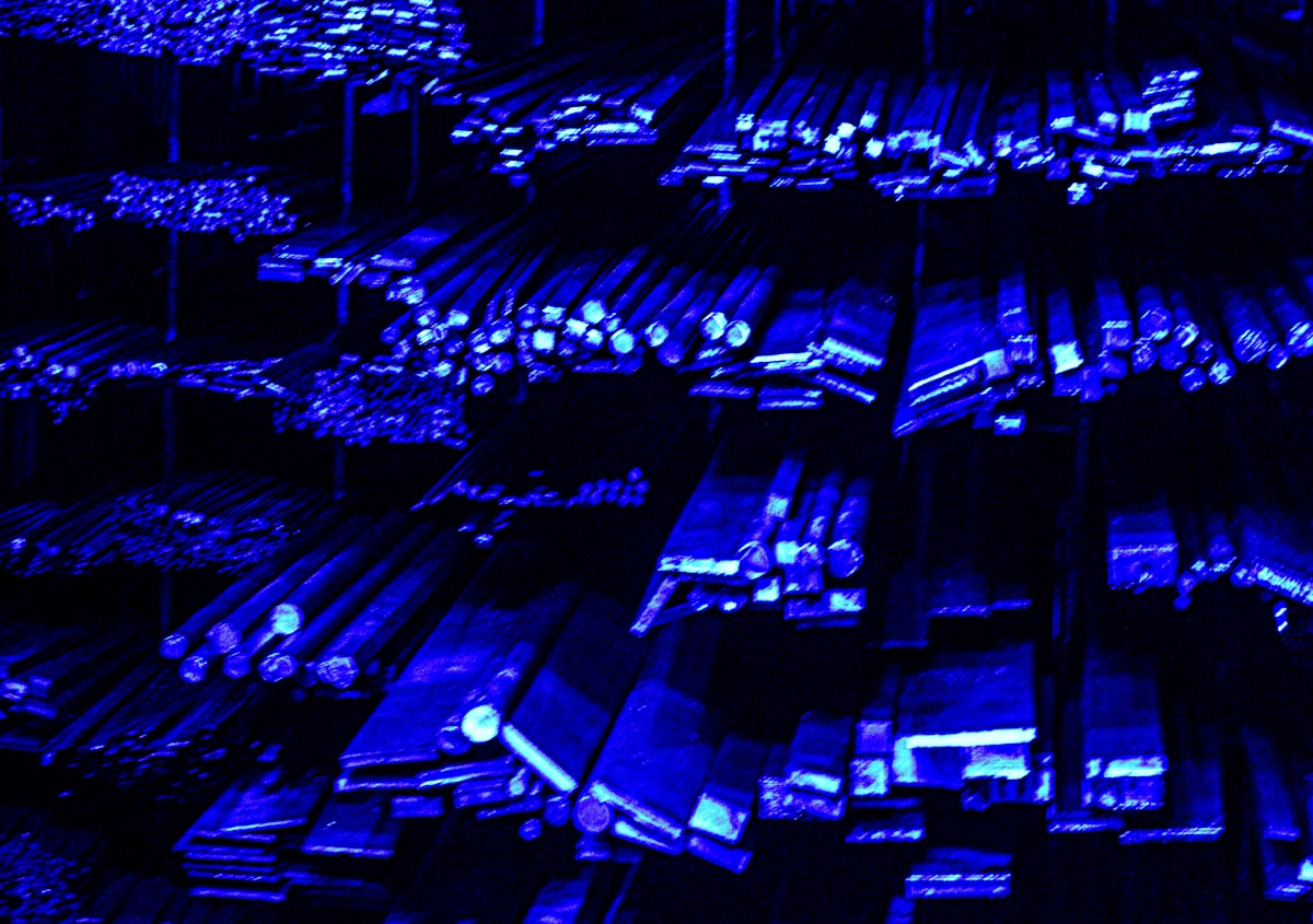 Rows of metal bars illuminated with blue light