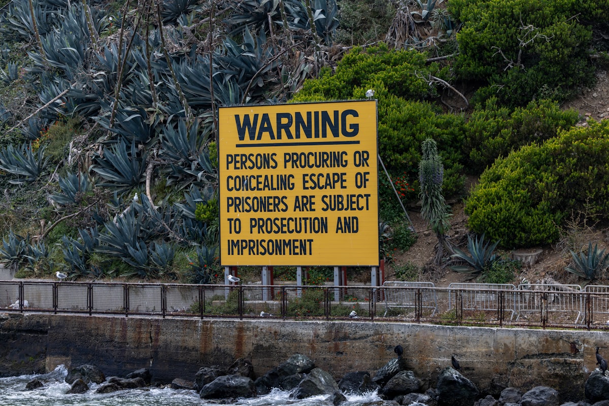 Alcatraz warning sign about aiding prisoner escape near water