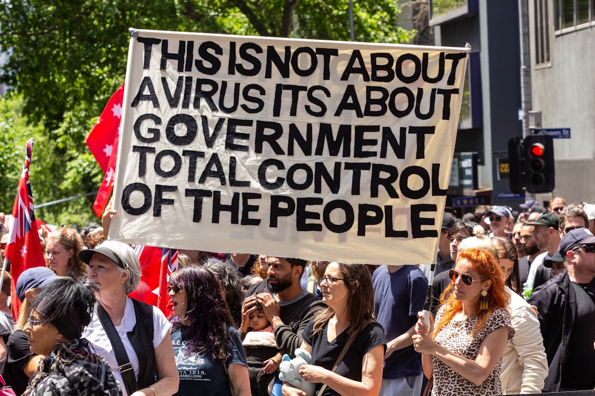 a group of people holding a protest sign
