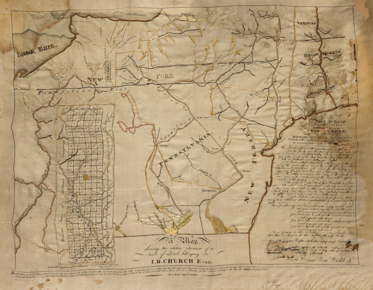An old, faded historical map with intricate details and text.