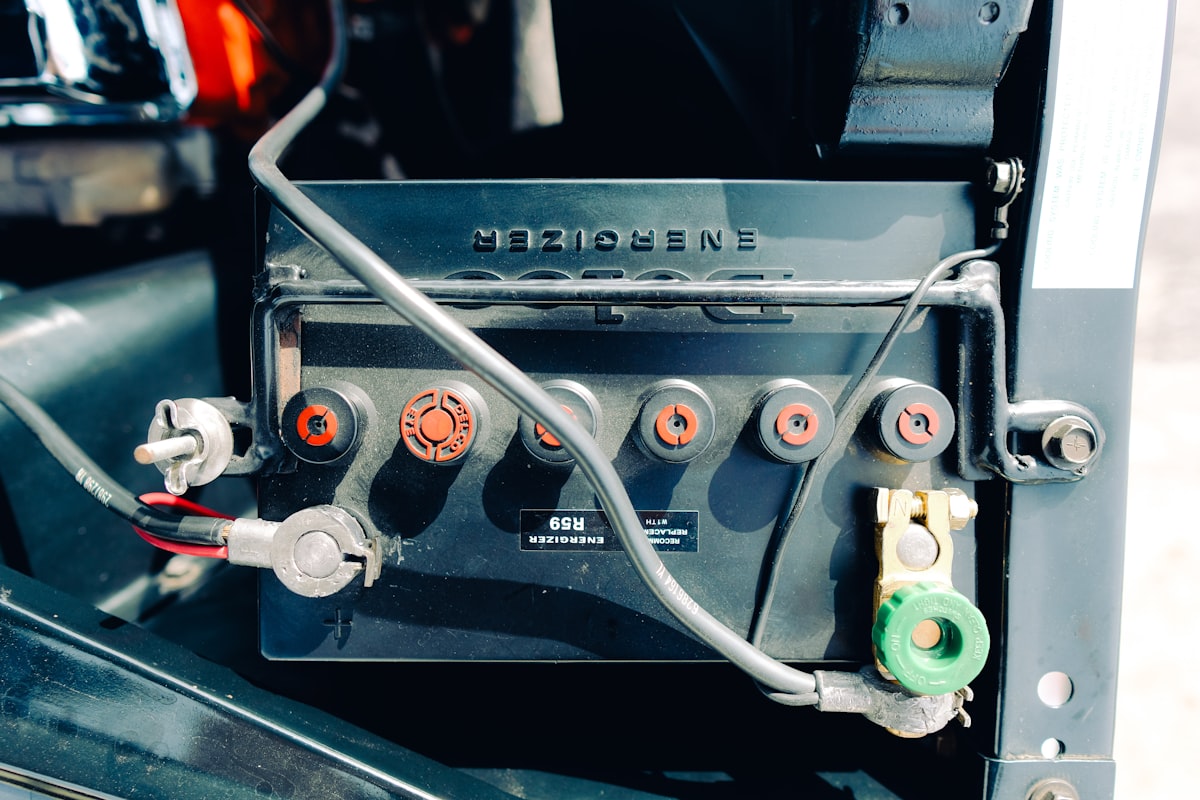 Close-up of a car battery with wires connected