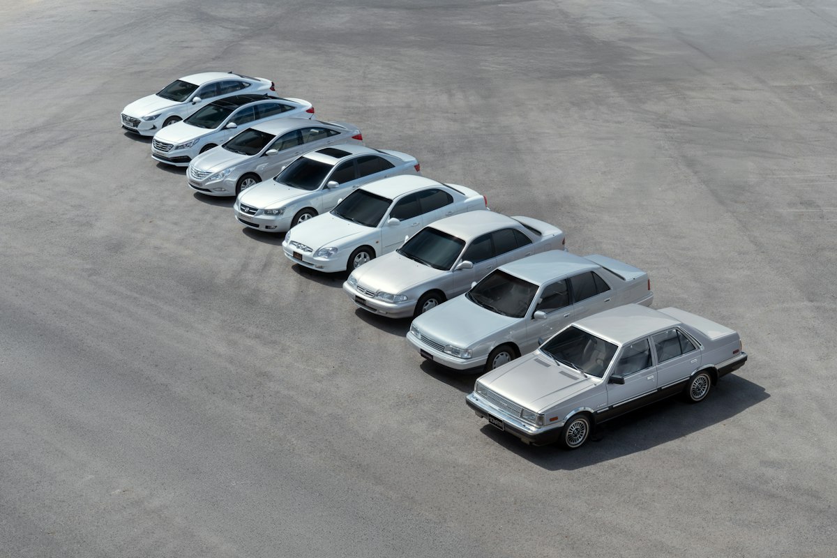 Several silver sedans parked in a row