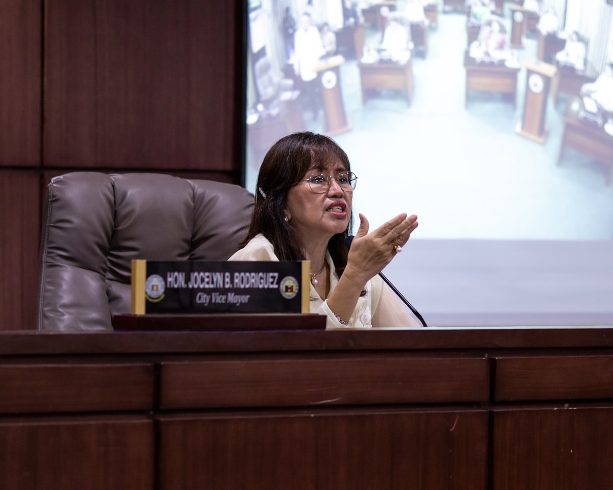 City mayor jocelyn r. rodriguez speaks at a meeting.
