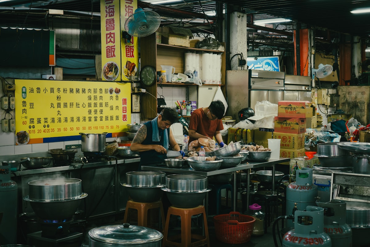 Chefs busy preparing food in a bustling kitchen